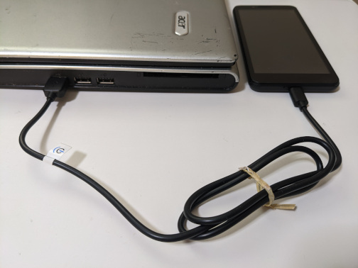 Phone connected to computer with USB cord